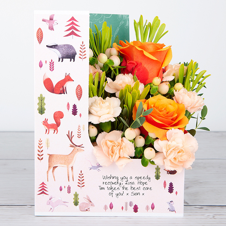 Lowlands Roses and Peach Hypericum with Waxflower and Tillandsia Flowercard image